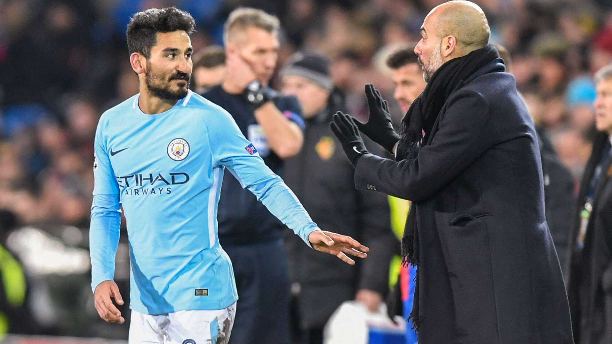 Ilkay Gündogan (l) und Pep Guardiola